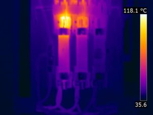 Thermal anomaly on a safety disconnect switch indicating a loose fuse clip contact (118°C/245°F)
